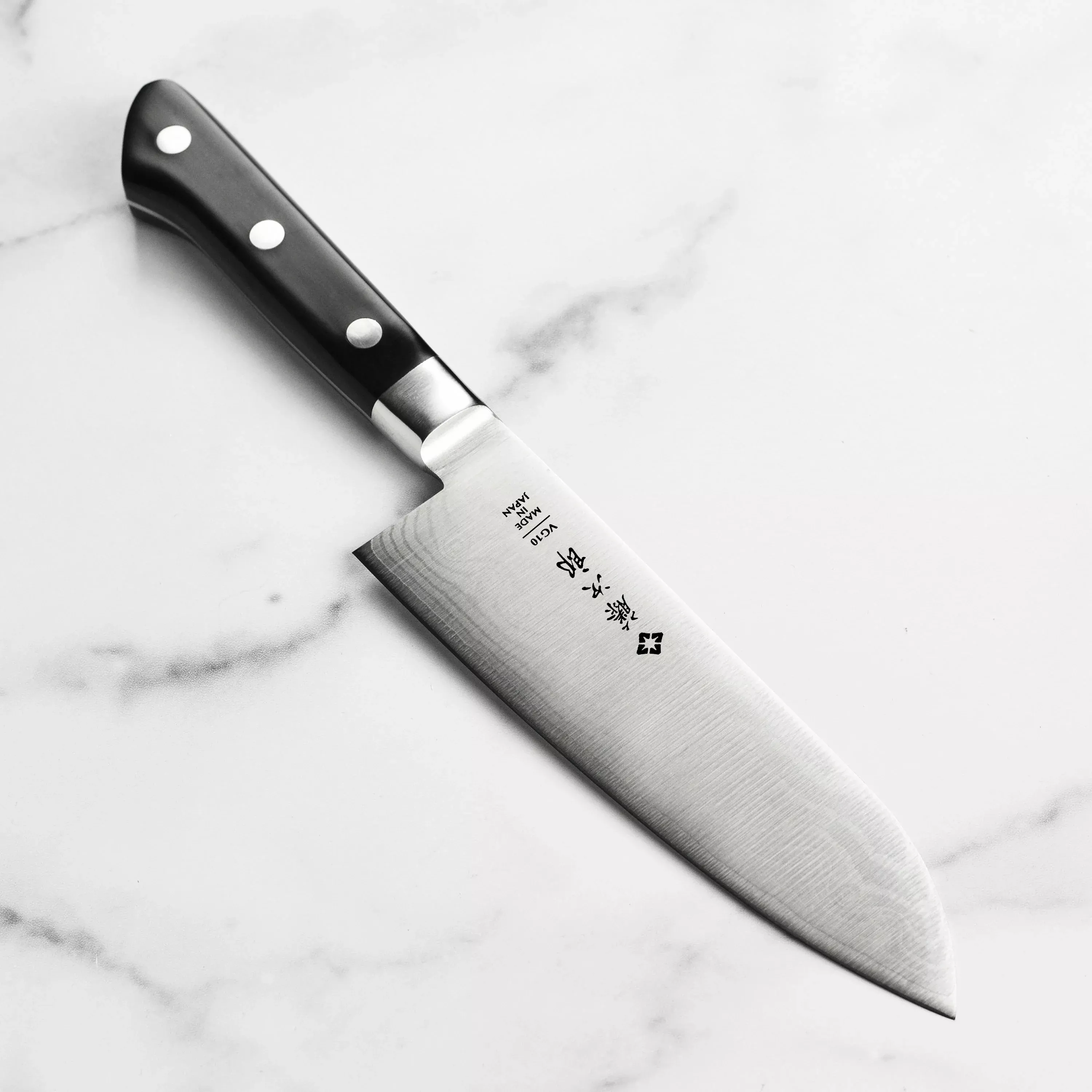 tojiro-classic-damascus-santoku-knife-7 Tojiro Classic Damascus Santoku Knife - 7"