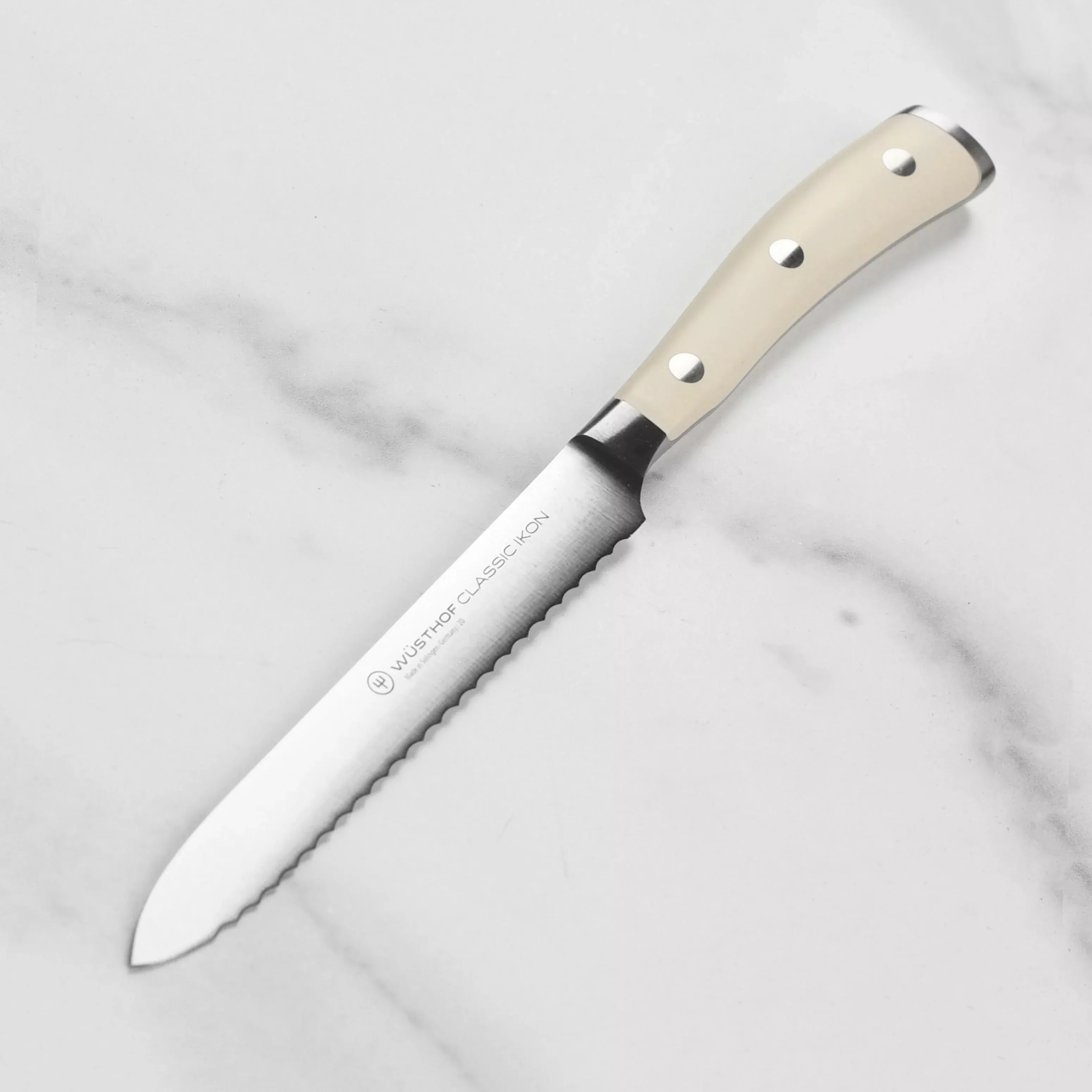 wusthof-classic-ikon-creme-serrated-utility-knife-5 Wusthof Classic Ikon Creme Serrated Utility Knife - 5"