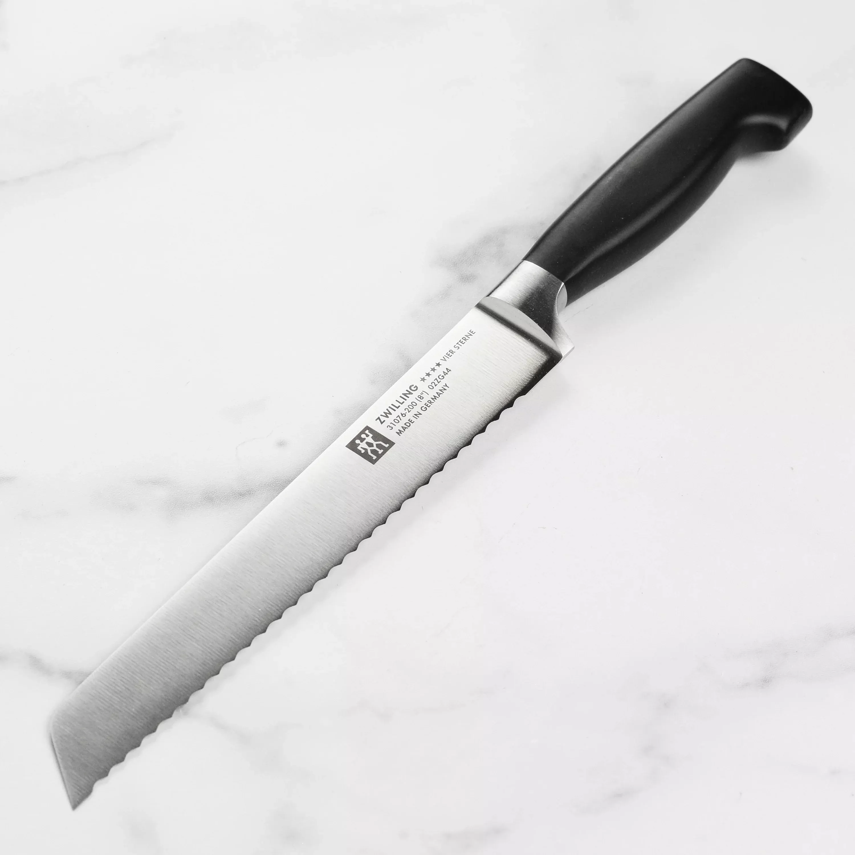 zwilling-j-henckels-four-star-bread-knife-8 Zwilling J.A. Henckels Four Star Bread Knife - 8"